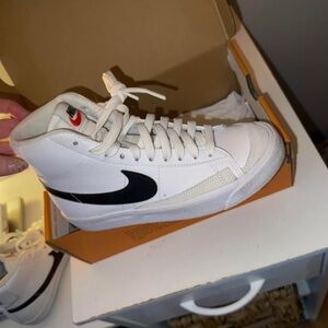 Nike Blazers Mid - Black and White 
willing to negotiate price :)